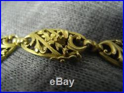 Bracelet ancien Art Nouveau années 20 volutes fleurs en or 18 carats
